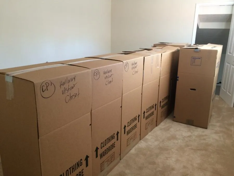 Picture of  Neatly stacked wardrobe boxes labeled for the hallway upstairs closet hint at a well-organized moving process, showcasing Advantage Moving & Storage’s commitment to quality outcomes. Copyright ©2025 Diamond Certified Resource.

 - Advantage Moving & Storage