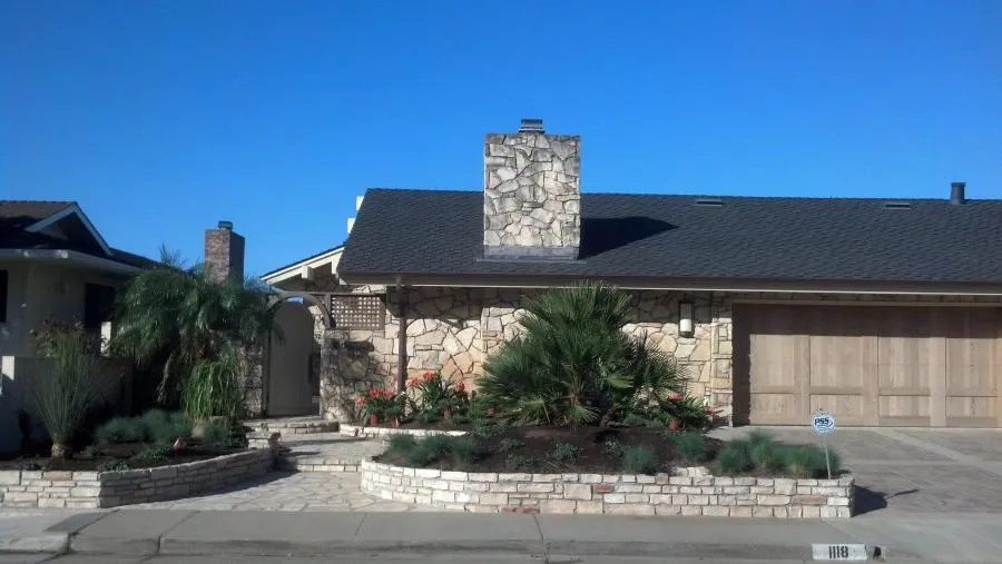 Picture of  A striking facade blends natural stone with meticulous landscaping, showcasing Jerry Allison Landscaping, Inc.'s commitment to quality outcomes. Recognized for expertise and quality, their work enhances curb appeal. Copyright ©2025 Diamond Certified Resource.

 - Jerry Allison Landscaping, Inc.