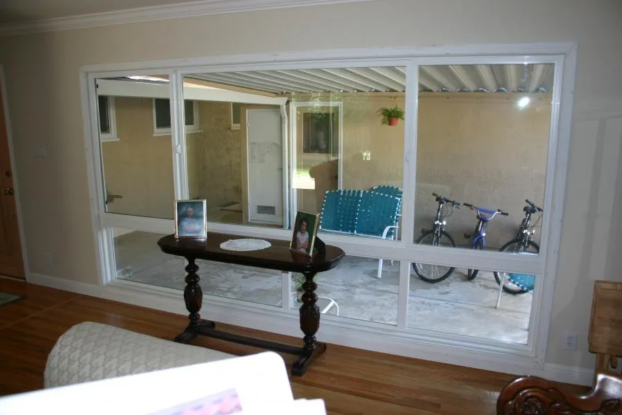 Picture of In this serene living space, a clear view of the patio is framed by expertly crafted windows, highlighting Able Glass Company's focus on quality outcomes. Copyright ©2025 Diamond Certified Resource. - Able Glass Company