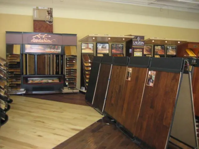 Picture of At The Floor Store, rows of polished wood panels invite customers to explore quality flooring options. Recognized for expertise and quality, the company ensures high customer satisfaction. Copyright ©2025 Diamond Certified Resource - The Floor Store