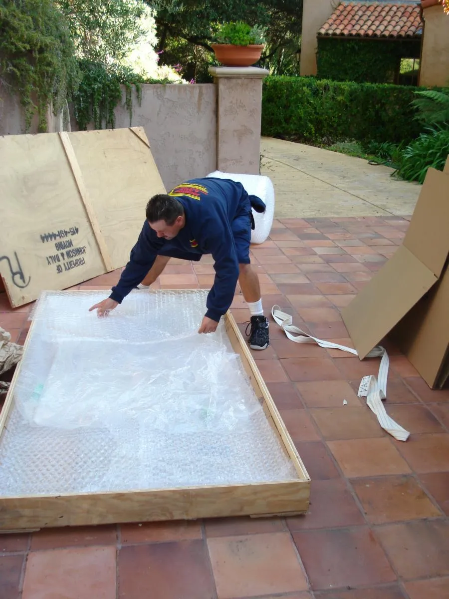 Picture of Amid terracotta tiles, a Johnson & Daly Moving & Storage professional carefully packs an item using bubble wrap, ensuring the highest quality outcome. This attentive approach is why the company consistently achieves a Highest in Quality rating. Copyright ©2025 Diamond Certified Resource

 - Johnson & Daly Moving & Storage
