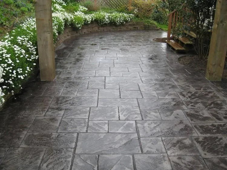 Picture of A beautifully laid stone patio by Kodiak Construction showcases their commitment to quality outcomes. The meticulous design complements the surrounding greenery, reflecting their high customer satisfaction ratings. Copyright ©2025 Diamond Certified Resource

 - Kodiak Construction