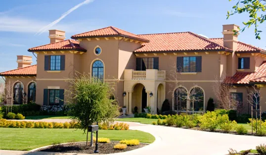 Picture of The Mediterranean-style home, with its terracotta roof and arched windows, stands proudly under the clear sky. Marco Roofing, recognized for expertise and quality, ensures the elegance and durability of such iconic roofs. Copyright ©2025 Diamond Certified Resource

 - Marco Roofing