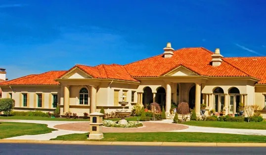 Picture of A stunning residence boasts a vibrant red-tiled roof, epitomizing Marco Roofing's commitment to quality outcomes. This project reflects their high customer satisfaction ratings. Copyright ©2025 Diamond Certified Resource

 - Marco Roofing