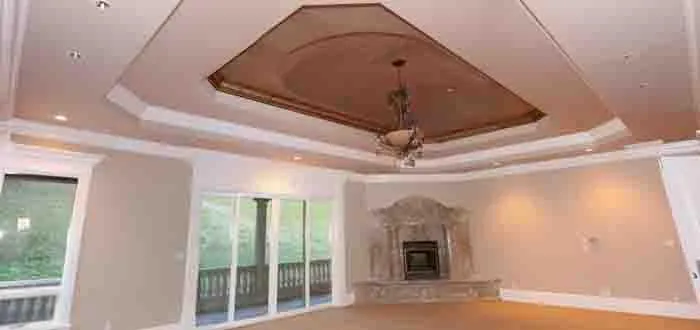 Picture of A newly painted living room showcases a sophisticated coffered ceiling and intricate chandelier, encapsulating the artistry at the heart of Steve Roberts Painting. This room reflects the company's focus on quality outcomes, offering a serene retreat. Copyright ©2025 Diamond Certified Resource

 - Steve Roberts Painting