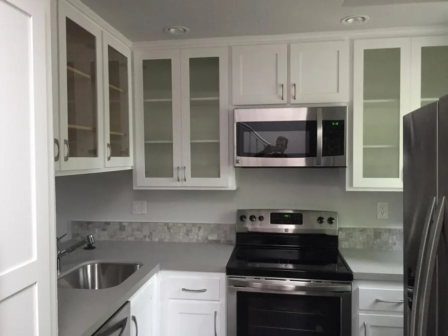 Picture of In this pristine kitchen, NBE Property Restoration highlights its commitment to quality outcomes with sleek cabinetry and refined finishes. The company earned Diamond Certified for its dedication to excellence. Copyright ©2025 Diamond Certified Resource

 - NBE Property Restoration