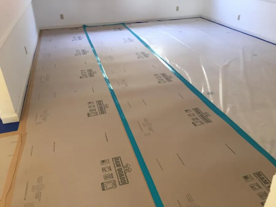 Picture of Meticulous preparation is key at NBE Property Restoration, where floors are carefully shielded with protective coverings. This attention to detail reflects our focus on quality outcomes. Copyright ©2025 Diamond Certified Resource

 - NBE Property Restoration
