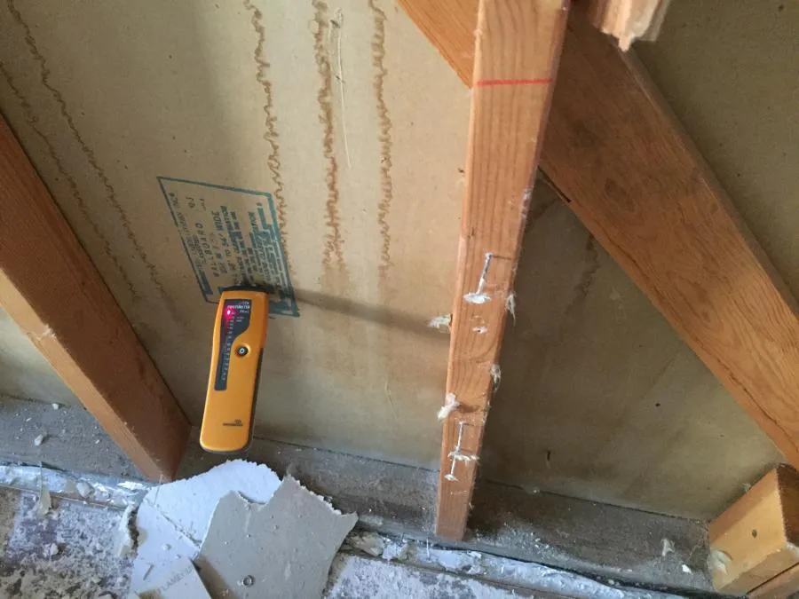 Picture of In a subtle display of meticulous attention, a moisture meter assesses the wooden framework's integrity, reflecting NBE Property Restoration's dedication to quality outcomes. This precision echoes their focus on quality. Copyright ©2025 Diamond Certified Resource - NBE Property Restoration