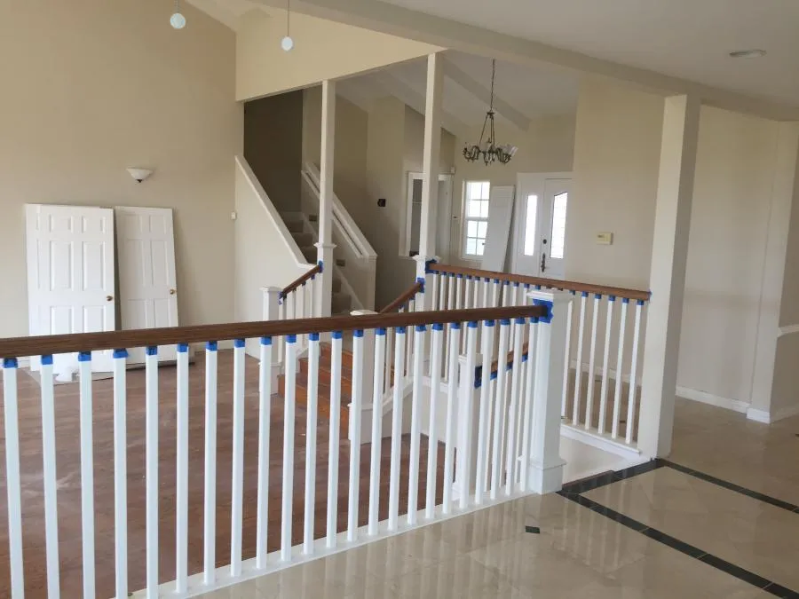 Picture of An intricately designed staircase awaits final touches in a bright, airy interior space. NBE Property Restoration, recognized for expertise and quality, oversees the transformative process. Copyright ©2025 Diamond Certified Resource - NBE Property Restoration