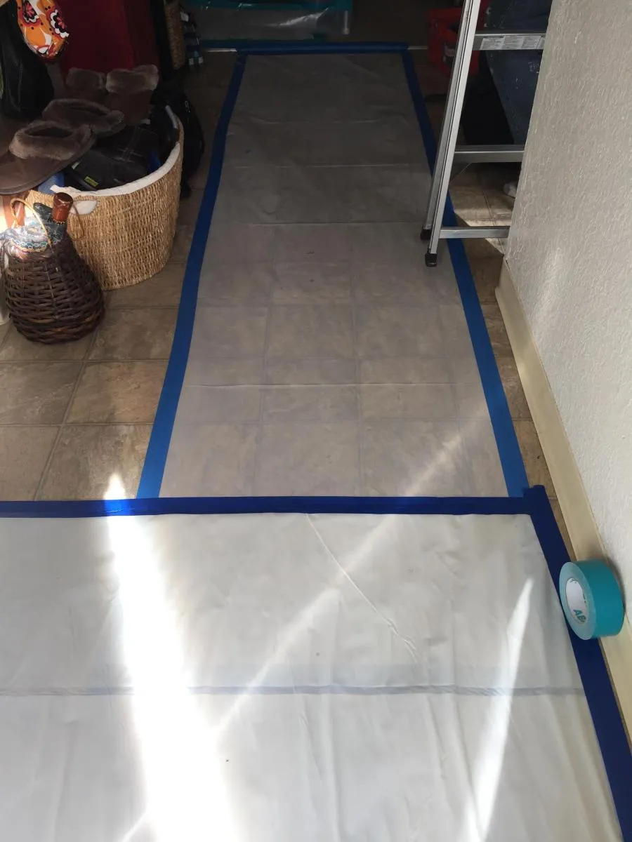 Picture of A hallway is carefully protected with taped coverings, highlighting NBE Property Restorationâ€™s commitment to quality outcomes. Such meticulous preparation reflects their high customer satisfaction ratings. Copyright ©2025 Diamond Certified Resource

 - NBE Property Restoration