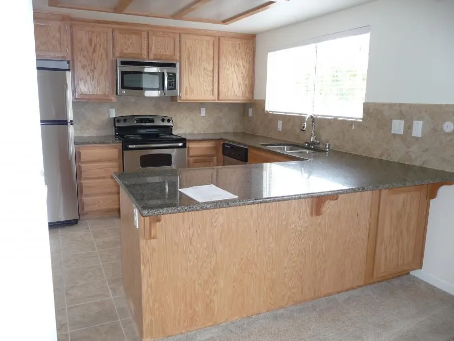 Picture of In a beautifully restored kitchen, NBE Property Restoration showcases its commitment to quality with sleek granite countertops and stainless steel appliances. Recognized for expertise and quality, their attention to detail is evident in every corner. Copyright ©2025 Diamond Certified Resource

 - NBE Property Restoration