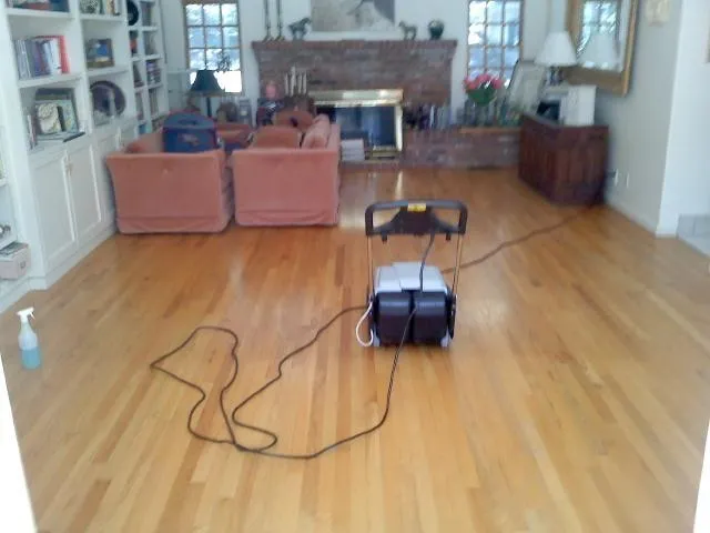 Picture of  A floor cleaning machine stands ready amidst a living room, capturing North Coast Carpet Care, Inc.'s focus on quality outcomes. The scene hints at meticulous care and expertise. Copyright ©2025 Diamond Certified Resource.  

 - North Coast Carpet Care, Inc.