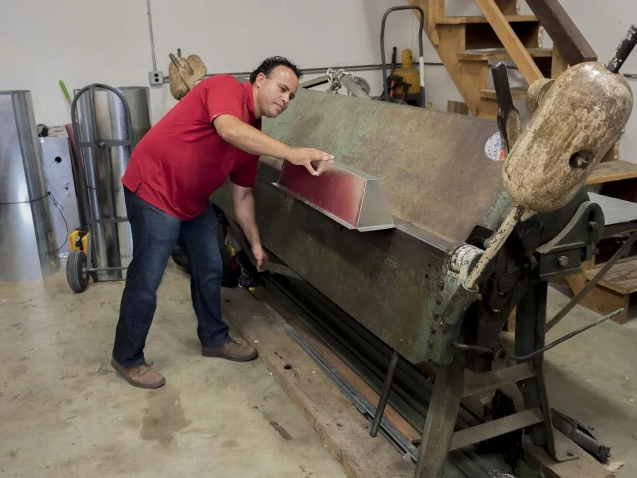Picture of A technician from Ortiz Heating and Air Conditioning demonstrates precision metalwork, reflecting the companyâ€™s focus on quality outcomes. Recognized for expertise and quality. Copyright ©2025 Diamond Certified Resource

 - Ortiz Heating and Air Conditioning