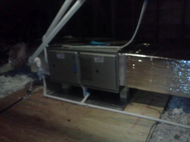 Picture of In the dim attic space, a well-installed HVAC unit rests on a wooden platform, showcasing Ortiz Heating and Air Conditioningâ€™s dedication to quality outcomes. Consistently achieving a Highest in Quality rating ensures the comfort of every home. Copyright ©2025 Diamond Certified Resource

 - Ortiz Heating and Air Conditioning