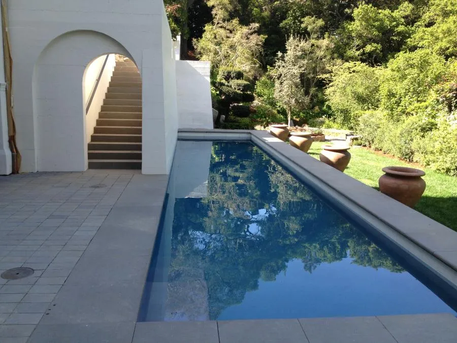 Picture of Elegance meets tranquility as a serene lap pool mirrors the lush greenery surrounding it. Classic Pools creates these harmonious environments with a focus on quality outcomes. Copyright ©2025 Diamond Certified Resource

 - Classic Pools