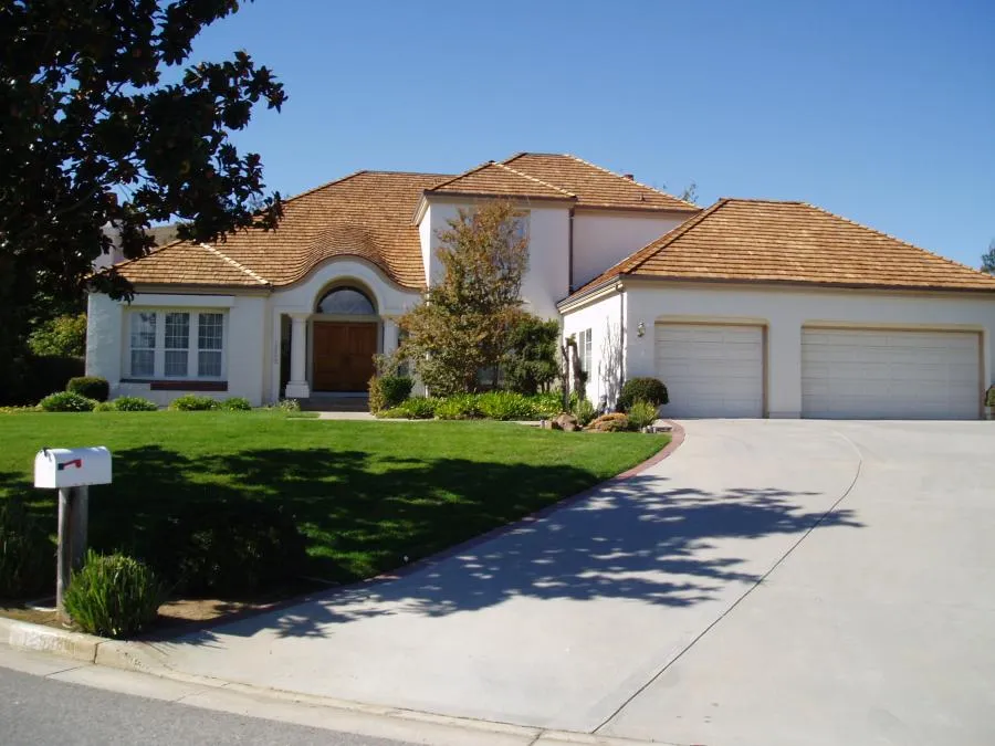 Picture of A well-maintained home showcases its elegant wooden roof, exemplifying Los Gatos Roofing's commitment to quality outcomes. The home's symmetry and lush surroundings highlight the importance of expert craftsmanship. Los Gatos Roofing has consistently achieved a Highest in Quality rating. Copyright ©2025 Diamond Certified Resource - Los Gatos Roofing