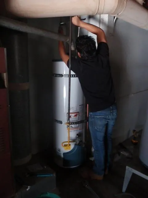 Picture of 
A technician from Atlas Plumbing & Rooter diligently aligns a pipe above a water heater, embodying the company's focus on quality outcomes. With a keen eye for detail, the scene reflects their dedication to excellence. Copyright ©2025 Diamond Certified Resource

 - Atlas Plumbing & Rooter