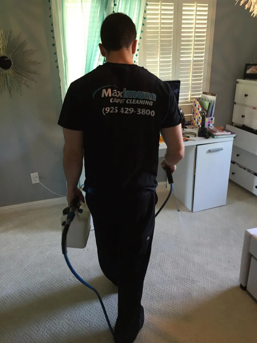 Picture of A technician from Maximum Carpet Cleaning professionally navigates a cozy room, ensuring each fiber gleams with care. Recognized for expertise and quality, the company consistently achieves high ratings. Copyright ©2025 Diamond Certified Resource - Maximum Carpet Cleaning