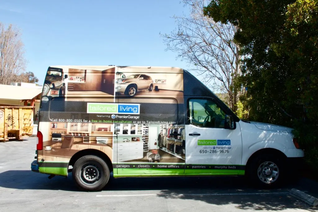 Picture of A PremierGarage service van, adorned with vibrant imagery of organized spaces, awaits its next destination. This vehicle symbolizes PremierGarage's dedication to quality outcomes in enhancing home storage solutions. Copyright ©2025 Diamond Certified Resource

 - PremierGarage