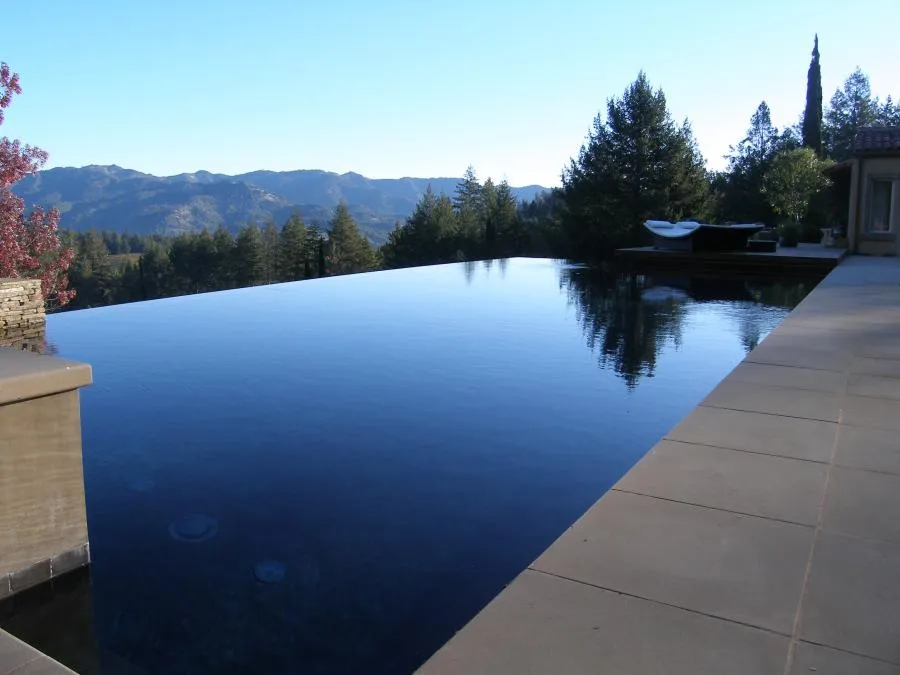 Picture of In the serene embrace of nature, Classic Pools crafts a seamless horizon where water meets sky, reflecting their commitment to quality outcomes. Copyright ©2025 Diamond Certified Resource - Classic Pools