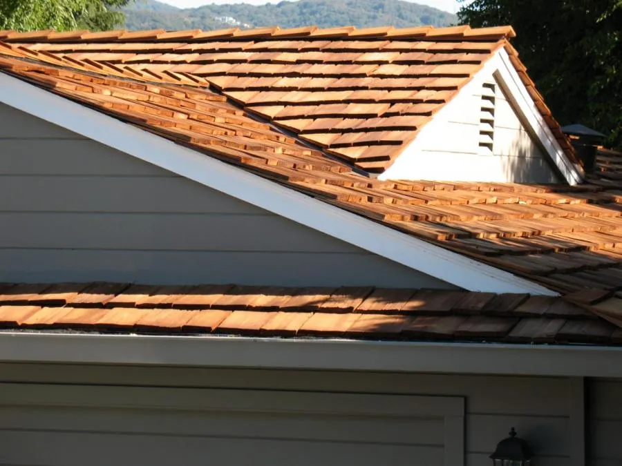 Picture of Sunlight casts a warm glow over the newly installed cedar shingles, reflecting Los Gatos Roofingâ€™s commitment to quality outcomes. The meticulous craftsmanship signifies the companyâ€™s focus on excellence. Copyright ©2025 Diamond Certified Resource - Los Gatos Roofing