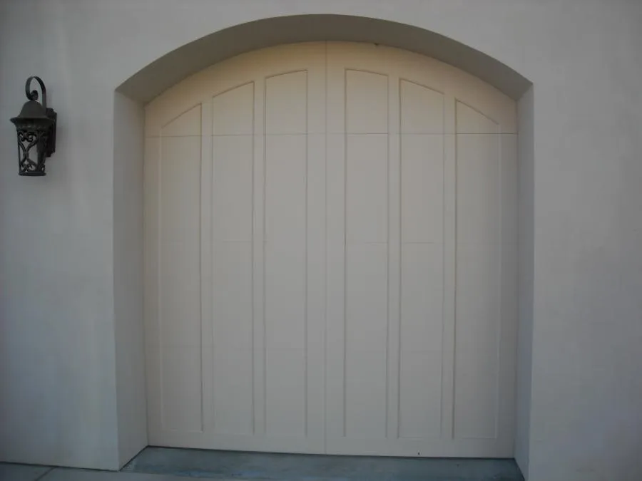 Picture of The elegantly arched garage door at a residential property showcases R & P Garage Doors' dedication to quality outcomes. Such refined designs highlight the company's commitment to excellence in craftsmanship. R & P Garage Doors consistently achieves the highest in quality ratings. Copyright ©2025 Diamond Certified Resource

 - R & P Garage Doors