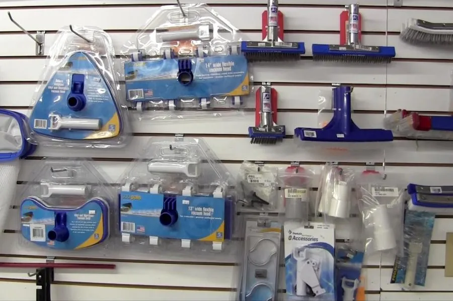 Picture of A neatly arranged selection of pool maintenance tools hangs on display at Roger's Pool & Spa Service Inc. This variety highlights their focus on quality outcomes, making them a trusted name in pool care. Copyright ©2025 Diamond Certified Resource

 - Roger's Pool & Spa Service Inc.