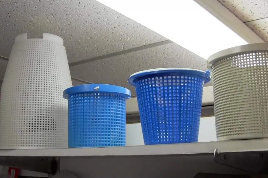 Picture of A row of pool filter baskets on a shelf highlights Roger's Pool & Spa Service Inc.'s commitment to quality outcomes in every service. The meticulous organization reflects their dedication to excellence. Copyright ©2025 Diamond Certified Resource

 - Roger's Pool & Spa Service Inc.