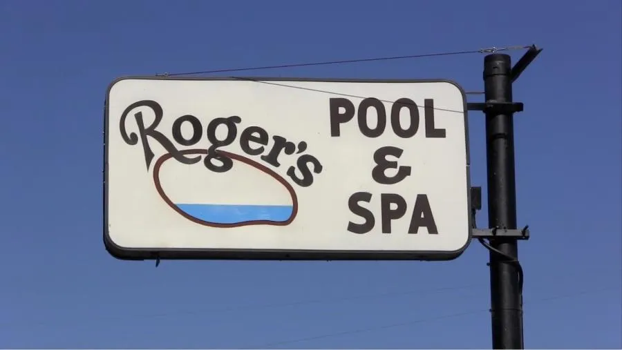 Picture of Amid a clear sky, the iconic sign of Roger's Pool & Spa Service Inc. quietly symbolizes their commitment to quality outcomes. As a company that focuses on quality outcomes, this attention is evident in every service. Copyright ©2025 Diamond Certified Resource - Roger's Pool & Spa Service Inc.
