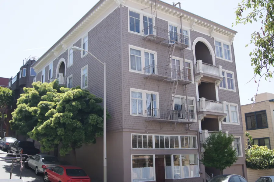 Picture of  A freshly painted apartment building stands proudly, capturing the light of a clear day—its crisp lines and smooth finish a testament to Michael Sack Painting, Inc.'s dedication to quality outcomes. Copyright ©2025 Diamond Certified Resource.

 - Michael Sack Painting, Inc.