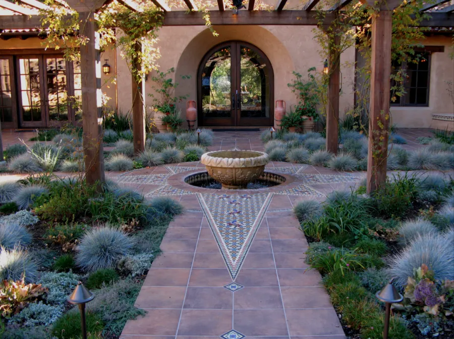 Picture of  In the serene embrace of a meticulously crafted courtyard, where the intricate tile work leads the eye to a central fountain, Jerry Allison Landscaping, Inc. showcases its commitment to quality outcomes. The harmonious design reflects the company’s focus on aesthetics and functionality. Copyright ©2025 Diamond Certified Resource.

 - Jerry Allison Landscaping, Inc.