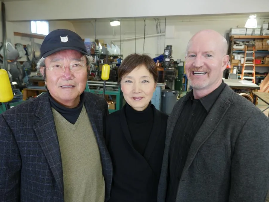 Picture of Within the workshop, three members of Sure Roofing & Waterproofing stand together, embodying a commitment to quality and expertise. The company is recognized for its high customer satisfaction ratings. Copyright ©2025 Diamond Certified Resource - Sure Roofing & Waterproofing
