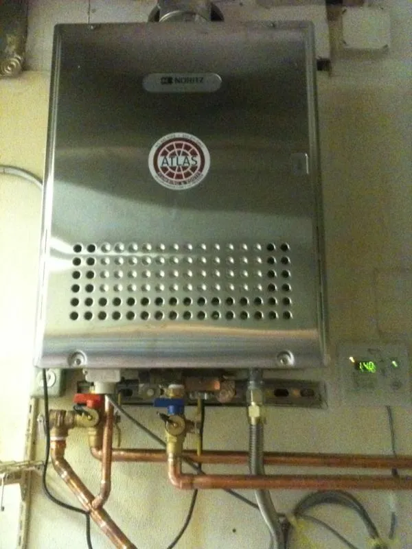 Picture of A flawlessly installed tankless water heater reflects Atlas Plumbing & Rooter's commitment to quality outcomes, showcasing their expertise. The precise arrangement of copper pipes underscores their attention to detail. Atlas Plumbing & Rooter, recognized for expertise and quality. Copyright ©2025 Diamond Certified Resource

 - Atlas Plumbing & Rooter