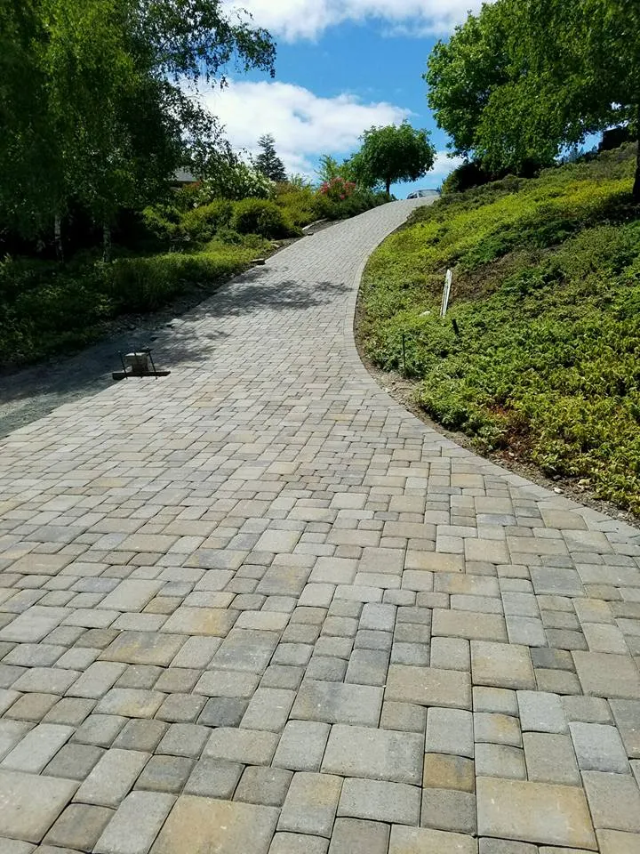 Picture of The Legacy Paver Group delivers another pristine pathway, showcasing their commitment to quality outcomes. This smoothly paved driveway reflects the companyâ€™s expertise in enhancing outdoor spaces. Copyright ©2025 Diamond Certified Resource

 - The Legacy Paver Group
