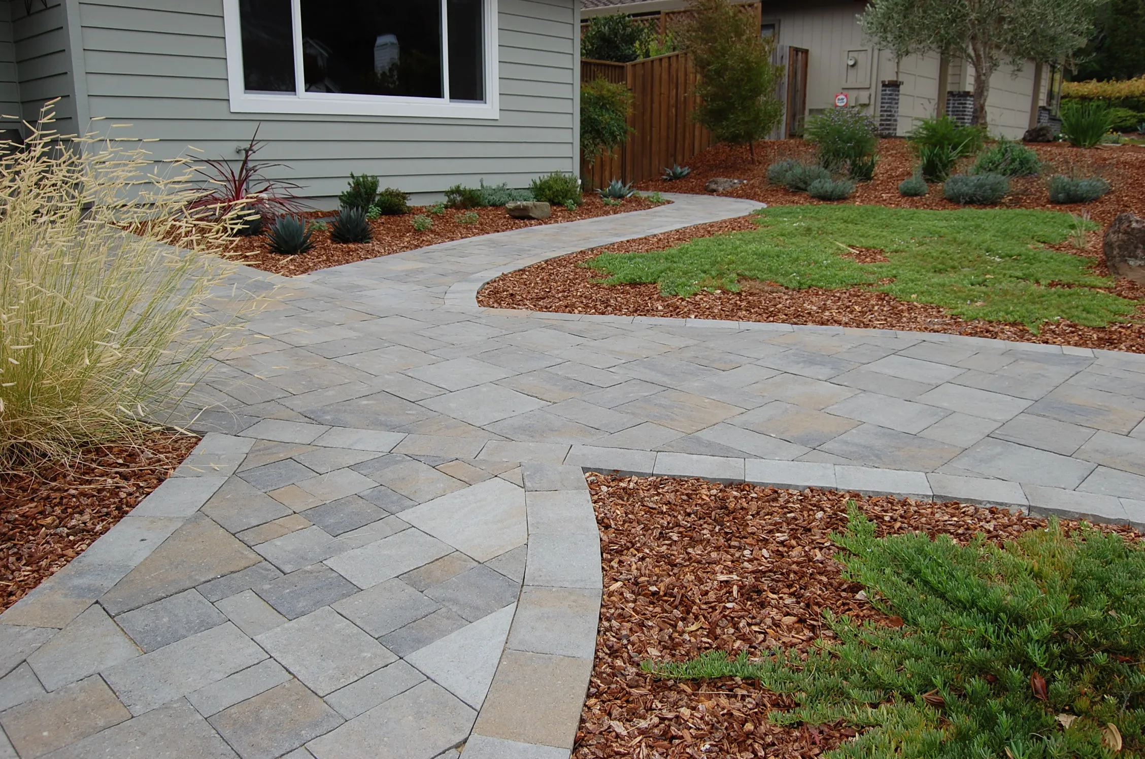 Picture of A meticulously crafted stone pathway winds gracefully through a garden, illustrating The Legacy Paver Group's commitment to quality outcomes. Recognized for expertise and quality, the company transforms ordinary spaces into elegant landscapes. Copyright ©2025 Diamond Certified Resource

 - The Legacy Paver Group