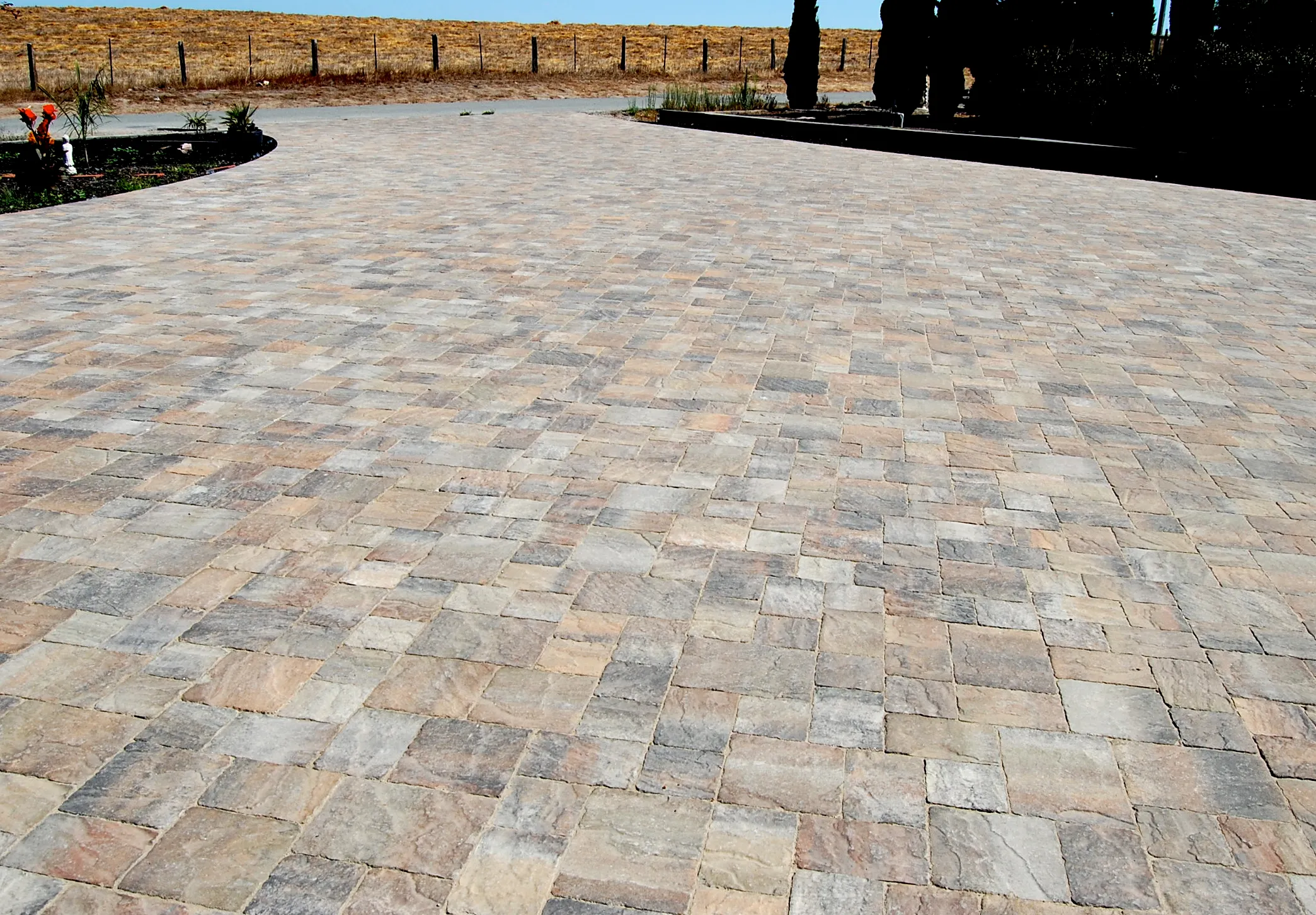 Picture of The Legacy Paver Group transforms outdoor spaces with expertly laid paving stones, reflecting their dedication to quality outcomes. This pristine driveway showcases their top-rated craftsmanship. Copyright ©2025 Diamond Certified Resource - The Legacy Paver Group