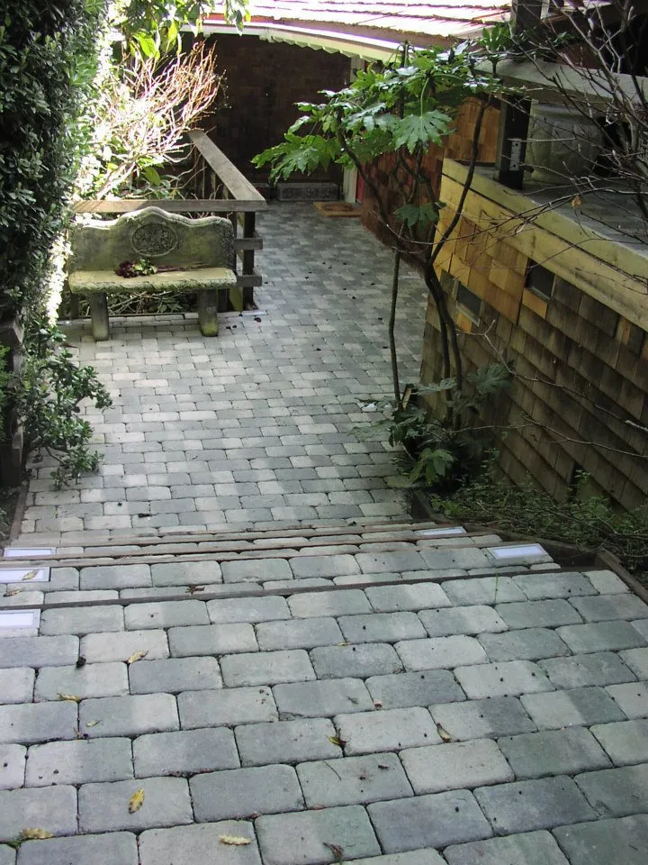 Picture of A meticulously crafted stone pathway leads to a serene garden bench, showcasing The Legacy Paver Group's consistent achievement in High Quality ratings. Copyright ©2025 Diamond Certified Resource

 - The Legacy Paver Group