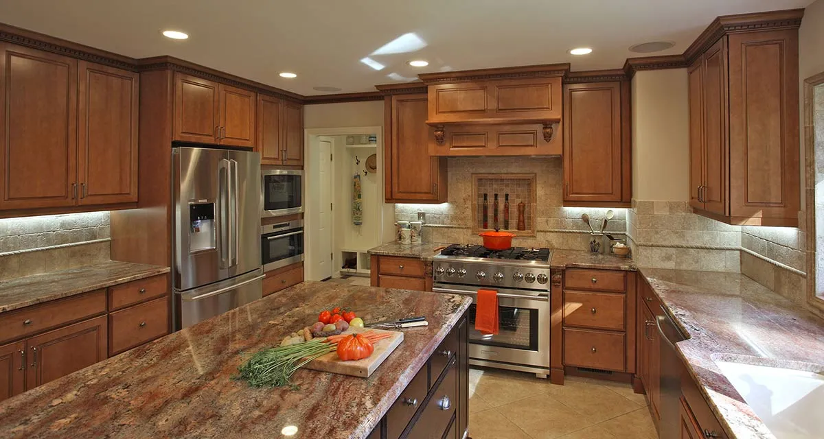 Picture of Amidst rich wooden cabinets and gleaming countertops, Today's Kitchen & Bath showcases their commitment to quality outcomes. The inviting kitchen space hints at culinary creativity waiting to unfold. Copyright ©2025 Diamond Certified Resource - Today's Kitchen & Bath
