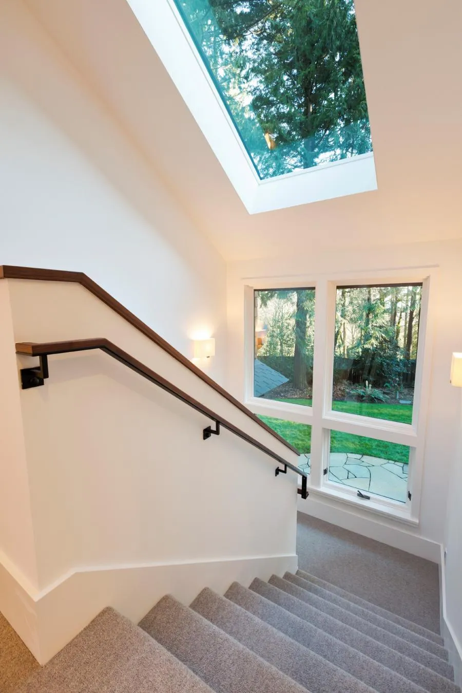 Picture of Sunlight pours through a strategically placed skylight, enhancing the warmth of this elegantly carpeted staircase. Wesco Screen Company Inc. expertly integrates natural light with their quality-focused solutions, consistently achieving the Highest in Quality rating. Copyright ©2025 Diamond Certified Resource

 - Wesco Screen Company Inc.