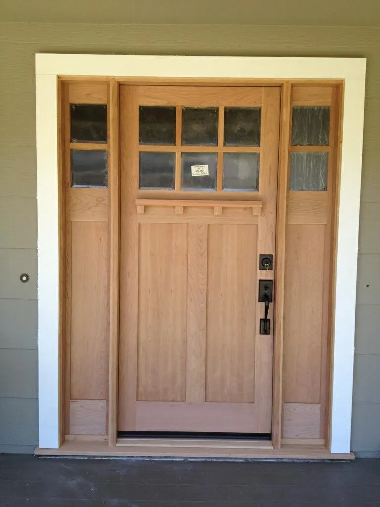 Picture of  A beautifully crafted wooden door graces the entrance, its design a testament to West Coast Windows and Doors, Inc.'s focus on quality outcomes. This attention to detail reflects their high customer satisfaction ratings. Copyright ©2025 Diamond Certified Resource.

 - West Coast Windows and Doors, Inc.