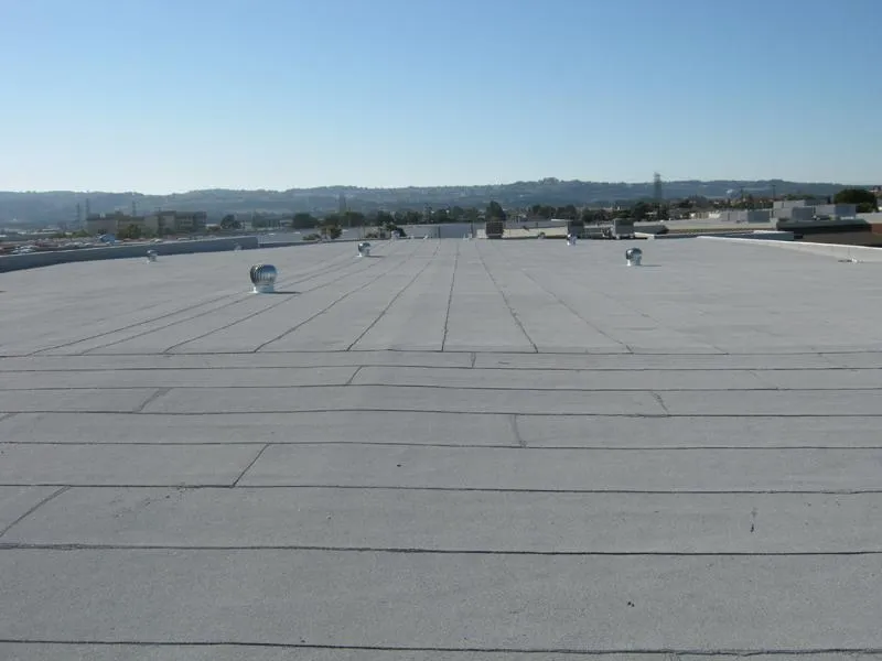 Picture of  The expansive flat roof glistens under the sun, showcasing Ben's Roofing, Inc.'s commitment to quality outcomes. With a focus on precision and expertise, the company consistently delivers effective solutions. Copyright ©2025 Diamond Certified Resource.

 - Ben's Roofing, Inc.