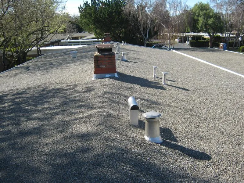 Picture of  A newly completed flat roof, meticulously installed by Ben's Roofing, Inc., showcases their commitment to quality outcomes. The gravel surface and precise vent placements reflect expertise. Copyright ©2025 Diamond Certified Resource.

 - Ben's Roofing, Inc.