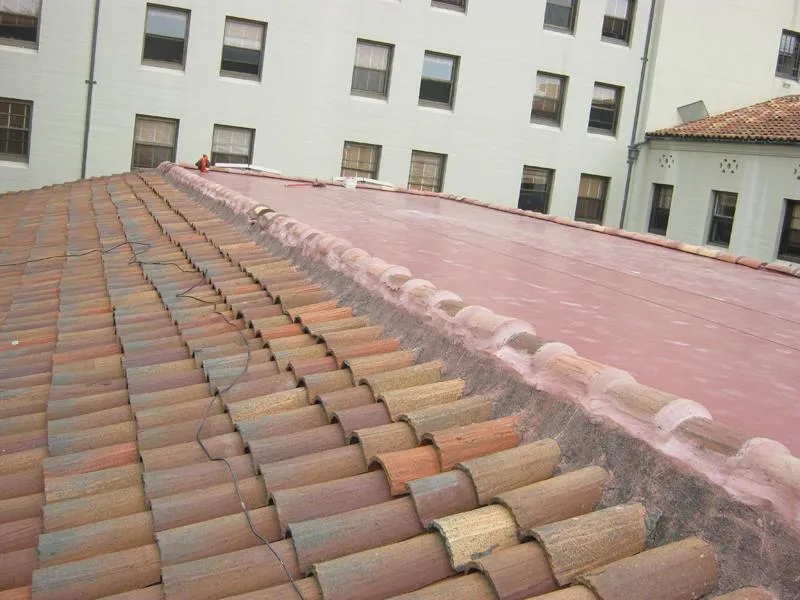 Picture of  Ben's Roofing, Inc. showcases its commitment to quality with a precise roofing project. A blend of terracotta tiles meets a flat roof under careful craftsmanship, reflecting the company's focus on quality outcomes. Copyright ©2025 Diamond Certified Resource.

 - Ben's Roofing, Inc.