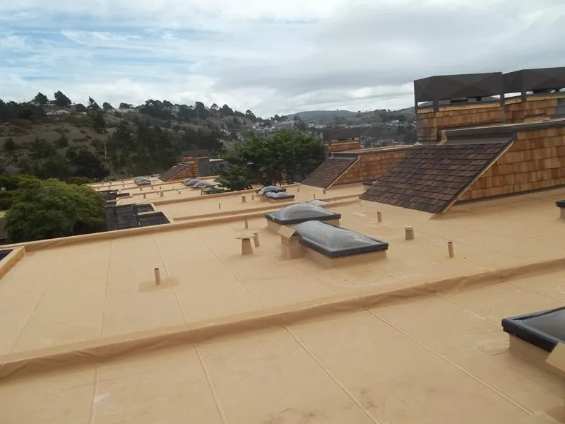 Picture of  A seamless expanse of newly installed flat roofing shows Ben's Roofing, Inc.'s dedication to quality outcomes, ensuring durability against the scenic backdrop. Achieving highest customer satisfaction is a testament to their expertise. Copyright ©2025 Diamond Certified Resource.

 - Ben's Roofing, Inc.