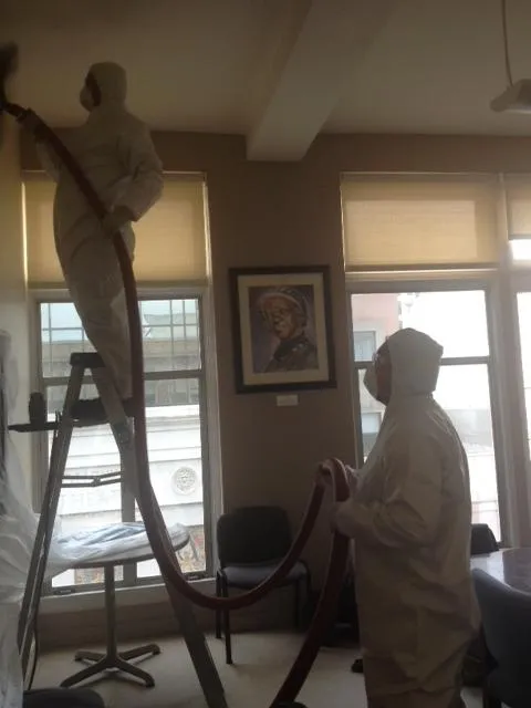 Picture of In a carefully orchestrated effort, technicians from Qualtech Heating & Cooling work diligently, clad in protective suits, focusing on ensuring quality outcomes in every detail. The company is recognized for its expertise and quality. Copyright ©2025 Diamond Certified Resource - Qualtech Heating & Cooling