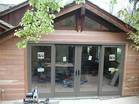 Picture of  A newly installed set of sliding glass doors subtly reflects the surrounding greenery, showcasing Quality Windows & Doors, Inc.'s commitment to quality outcomes. The precise fit enhances the aesthetic and functionality of the space, earning the company high customer satisfaction ratings. Copyright ©2025 Diamond Certified Resource.

 - Quality Windows & Doors, Inc.