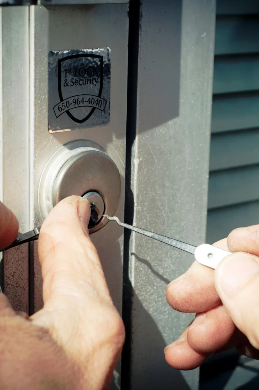 Picture of A skilled hand works diligently to unlock a door, embodying First Lock & Security Technologiesâ€™ commitment to quality outcomes. This moment captures their Diamond Certified expertise in action. Copyright ©2025 Diamond Certified Resource

 - First Lock & Security Technologies