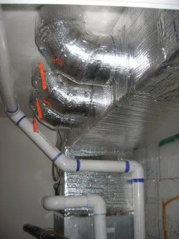 Picture of Intricately wrapped ductwork and precisely aligned piping showcase Innovative Mechanical, Inc.'s commitment to quality outcomes, ensuring optimal efficiency in tight spaces. Recognized for expertise and quality. Copyright ©2025 Diamond Certified Resource. - Innovative Mechanical, Inc.