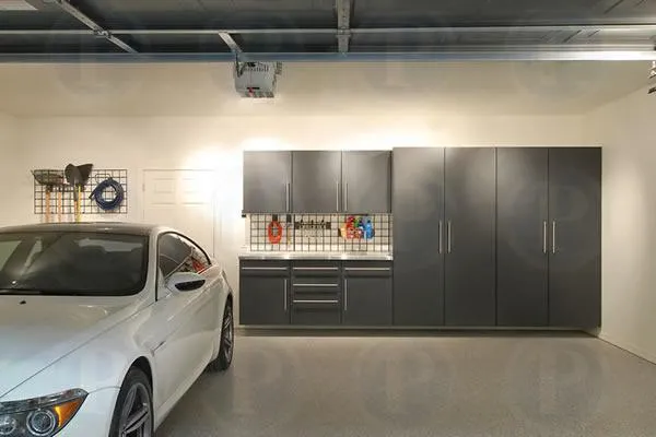 Picture of A pristine garage setup features sleek cabinetry and a polished vehicle, showcasing PremierGarage's dedication to quality outcomes. This refined space embodies the company's high customer satisfaction ratings. Copyright ©2025 Diamond Certified Resource

 - PremierGarage