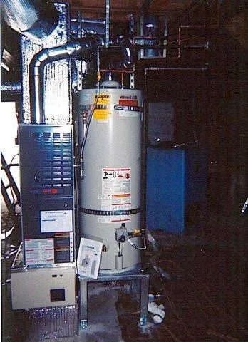 Picture of In the quiet heart of a utility room, a meticulously installed water heater and furnace stand testament to Innovative Mechanical, Inc.'s focus on quality outcomes. The company's commitment to excellence is underscored by its high customer satisfaction ratings. Copyright ©2025 Diamond Certified Resource. - Innovative Mechanical, Inc.